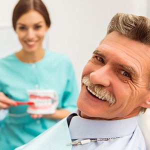 Man in dental chair for preventive dentistry treatment