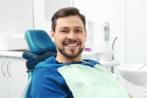Man smiling after one visit dental restoration