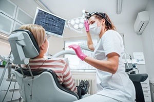 Dental hygienist interacting with patient