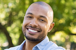 Man with brilliant smile after teeth whitening