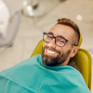 Happy, smiling male dental patient