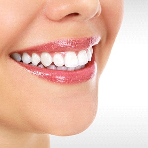 Close-up of beautiful smile with dental bonding and glossy lips