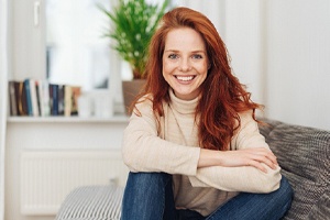 Patient smiling during her dental implant post-op period