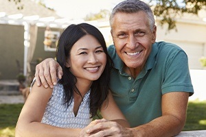 Smiling couple with dental implants in Northborough 