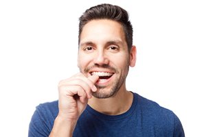 Man placing an Invisalign tray