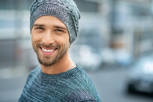 Handsome, smiling man enjoying benefits of porcelain veneers