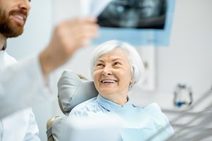 Woman smiling after oral cancer screening