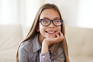 Young girl with healthy smile after children's dentistry treatment