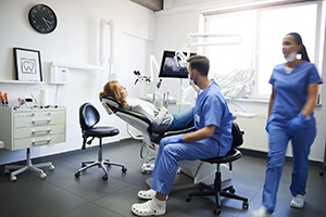 Dentist and patient during full mouth reconstruction consultation