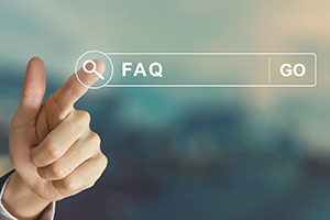 Touchscreen with finger pointing to FAQ icon