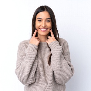 Woman showing off her smile after teeth whitening in Northborough