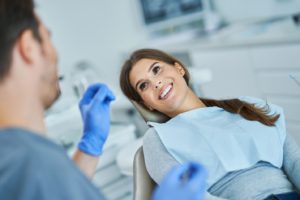 Dentist and dental patient talking about tooth extraction in Northborough