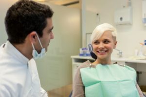 Dentist and patient engaged in conversation