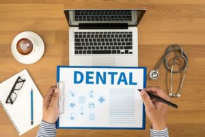 Dental benefits information on clipboard