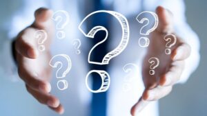 Question marks floating between person’s hands 